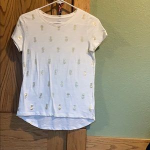 Soft tee shirt with gold pineapples.